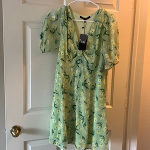Little green sundresss. Small size with tag never worn.